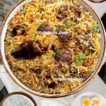 Authentic Mughlai biryani, Dum mutton biryani recipe, How to make Mughlai biryani, Indian royal biryani recipe, lamb mutton biryani, Layered biryani recipe, Mughlai cuisine biryani, Mughlai mutton biryani, Mughlai mutton biryani recipe, Mutton biryani with yogurt marinade, Saffron mutton biryani, Traditional Mughlai lamb biryani